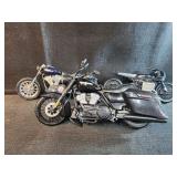 Motorcycles, 2 are Harley Davidson 1 is plastic