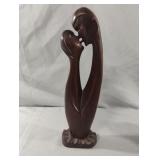 Abstract hand carved man and woman wood sculpture