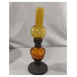 Vintage amber oil lamp. Globe has tiny chips