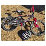 Next Surge Raceteam boys bicycle with a helmet