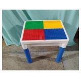 Lego and mega block table with Legos. 16 1/2 x 17