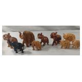 Hand carved elephant statues. Missing tusks or