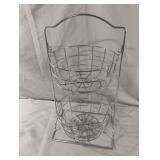 Metal fruit-vegetable baskets on a stand