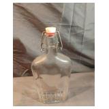 Glass pocket flask with a swing top 9" tall