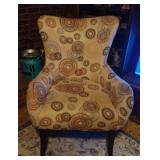 Wingback accent chair with a beige and brown