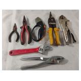 Adjustable wrench, snips, needle nose pliers and