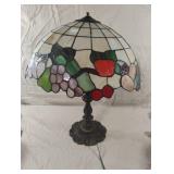Stain glass and brass lamp. Has a small crack on