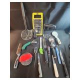 Assorted kitchen utensils, meat thermometer.