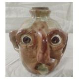 Handmade pottery face jug 