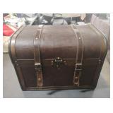 Trunk covered in leather on front and top. Needs