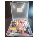 Assorted craft paints in plastic container