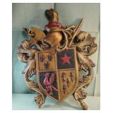 Decorative coat of arms wall plaque featuring