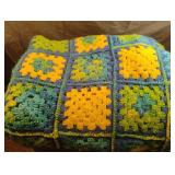 Crocheted throw with blues, greens and yellows