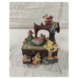 Vintage sewing machine music box featuring mice.