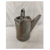 Vintage galvanized metal watering jug