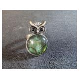 silver toned owl ring featuring a green abalone