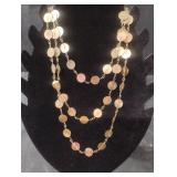 Multi stranded gold tone necklace
