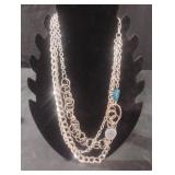 Multi-stranded silver tone necklace