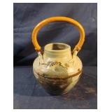 Pottery pot with bamboo handle. Signed and