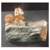 Vintage ceramic squirrel on a log planter