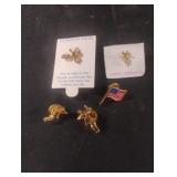 Angel pins and an American flag pin
