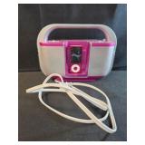 Pink ipod and Portable Radio, charging staion
