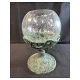 clear crackled glass bowl on a verdigris cast