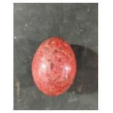 Polished egg-shaped gemstone