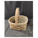 Handled basket with moveable handle