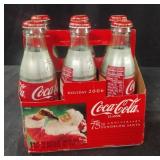 Vintage Coca-Cola 75th Anniversary bottles.