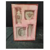 Ceramic pink flower bathroom accessories in a