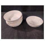 Vintage white ceramic bowl featuring an embossed