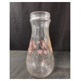 Vintage glass carafe featuring a pink floral