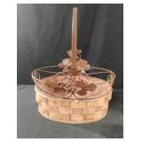 Basket with metal decorative handle