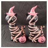 Black and pink cat figurines