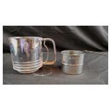 vintage metal flour sifter with a spring-loaded