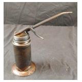 Vintage metal pump trigger oil can