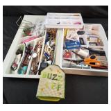 Drawer organizers with assorted contents,  fly