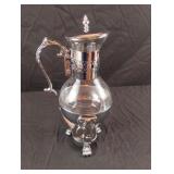 Vintage silver colored carafe with candle warmer