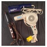 Hair dryers and a curling iron