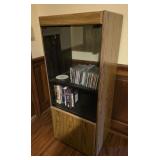 20x47 stereo cabinet with CDs and vhs tapes