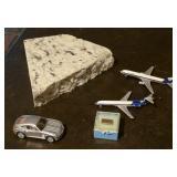 Piece of granite, diecast airplanes, car, RJR