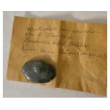 carved stone pendant, winged pendant representing