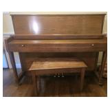 Baldwin piano and Bench with some Sheet Music