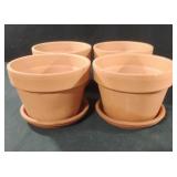 Terra cotta planters with plates. Set of 4