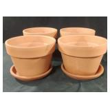 Terra Cotta planters with plates. Set of 4