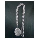 silver colored locket