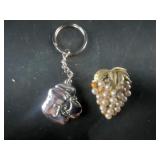 grape brooch and boot keychain