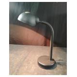 Black table top desk lamp. Works