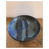 handcrafted studio pottery bowl features a dark